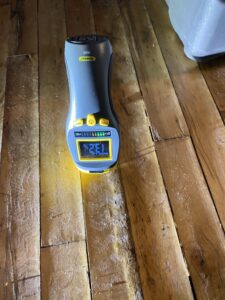 moisture reading at buckling floor in commercial office space in fulton market chicago - water damage restoration from chicago handyman